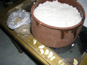 put rice over ful chop garlic and kumin